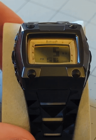The time displayed with spinning dots to the right of the hour