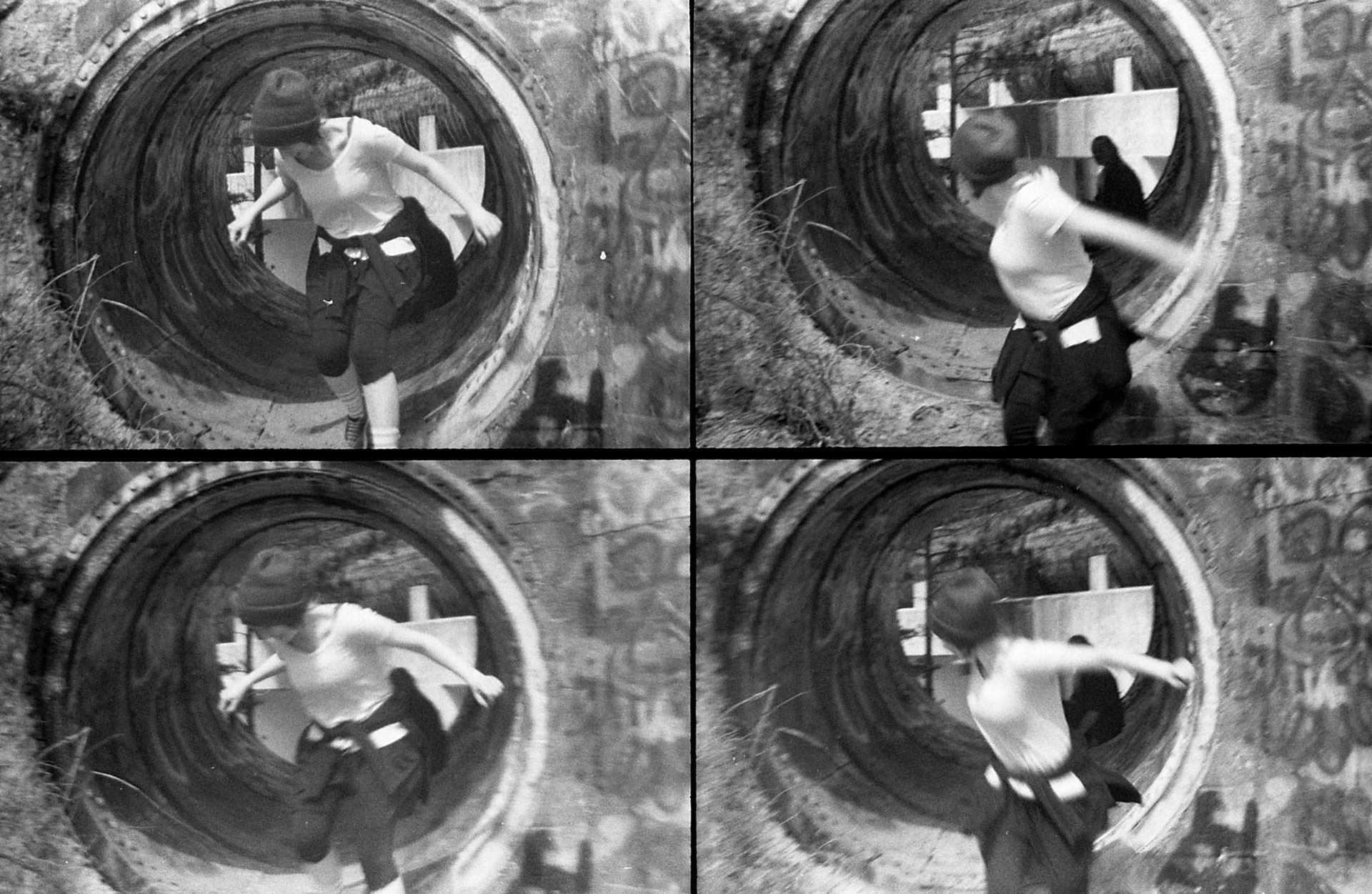 A person jumping out of a large tube