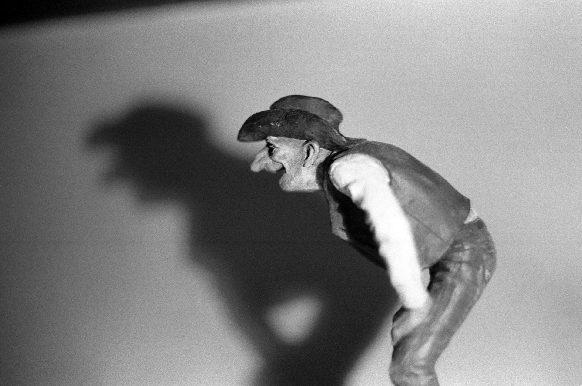 a macro photo of a statuette of a cowboy with a humorous expression