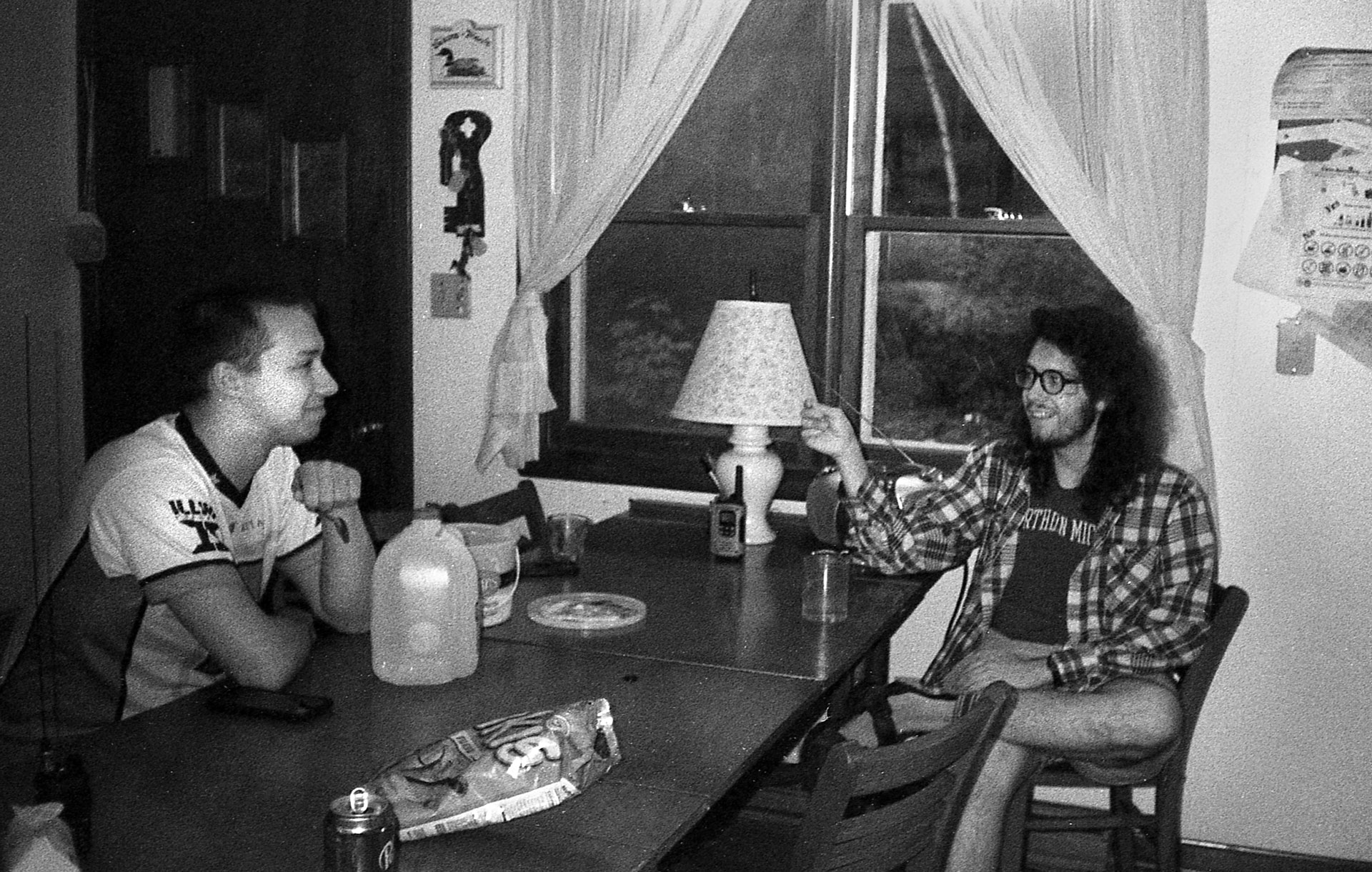 Two people sitting at a table, engaged in a discussion